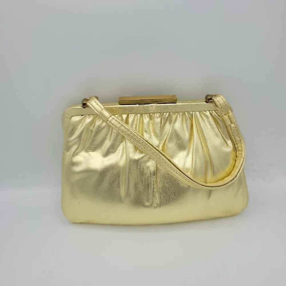 Vintage Andé Gold Clutch With Rhinestone Details Clasp.